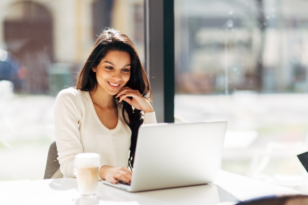 Woman enjoying a website on her computer