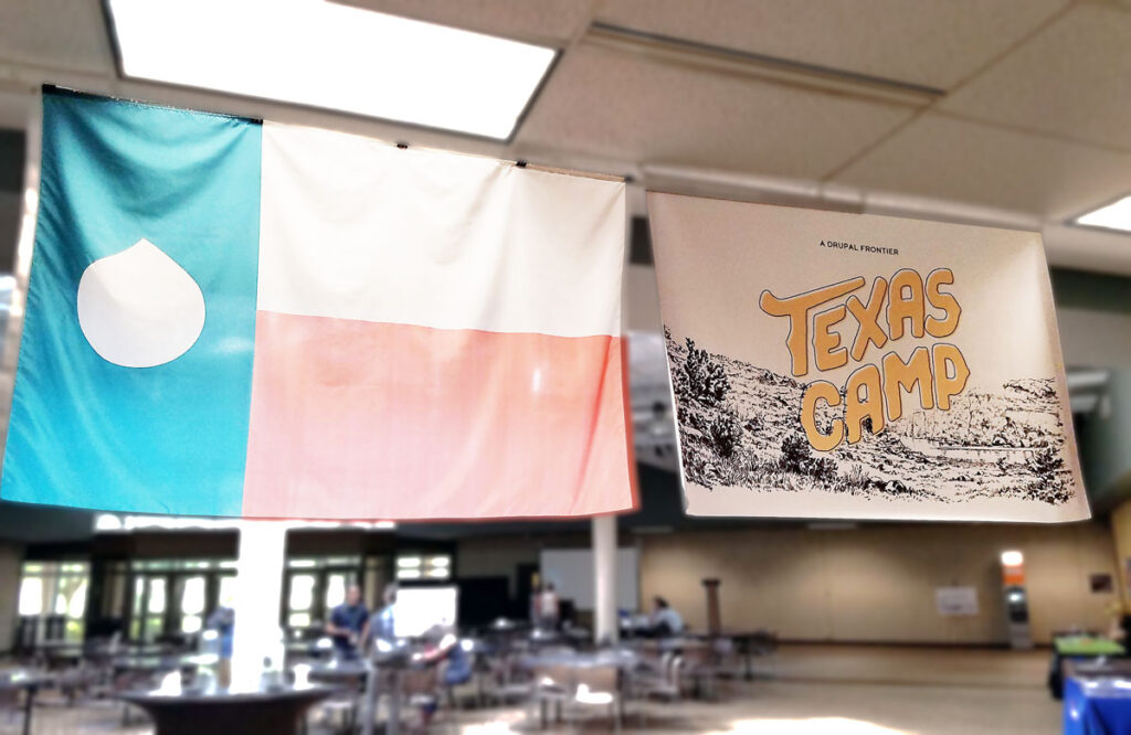 The Texas flag with a Drupal drop instead of a star, and the Texas Camp 2017 sign hanging from a ceiling