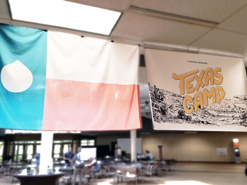 The Texas flag with a Drupal drop instead of a star, and the Texas Camp 2017 sign hanging from a ceiling