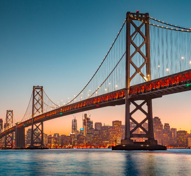 San Francisco skyline with Oakland Bay Bridge at sunset, California, USA