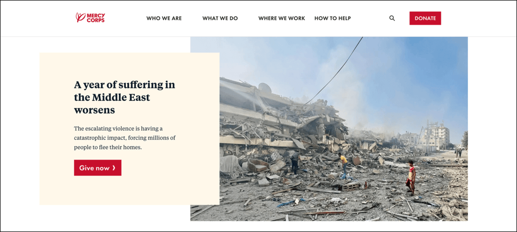 A screenshot of Mercy Corps’ homepage that features a heart-wrenching photo of destroyed buildings and strong calls-to-action to donate