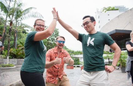 Kanopi's Jen Hill, Tim Tufts, and Joe Tuen giving high fives and thumbs up.