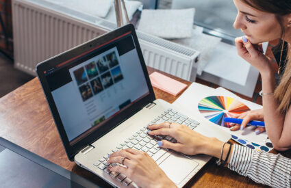 Two marketing professionals collaborating on building a webpage