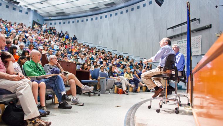 A full lecture hall listening in on a lecture at UC Berkeley