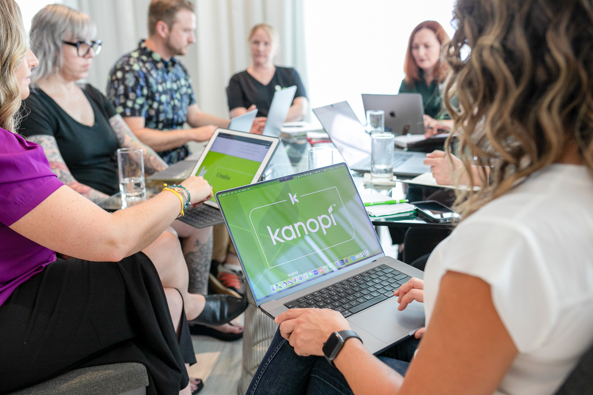 Kanopi team working at a conference table